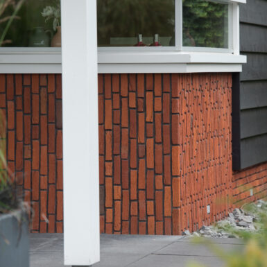 woonhuis sleeuwijk antigoon oranje rood genuanceerd steen